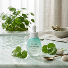 Urang Cica Soothing Ampoule, flacone in ambientazione naturale
